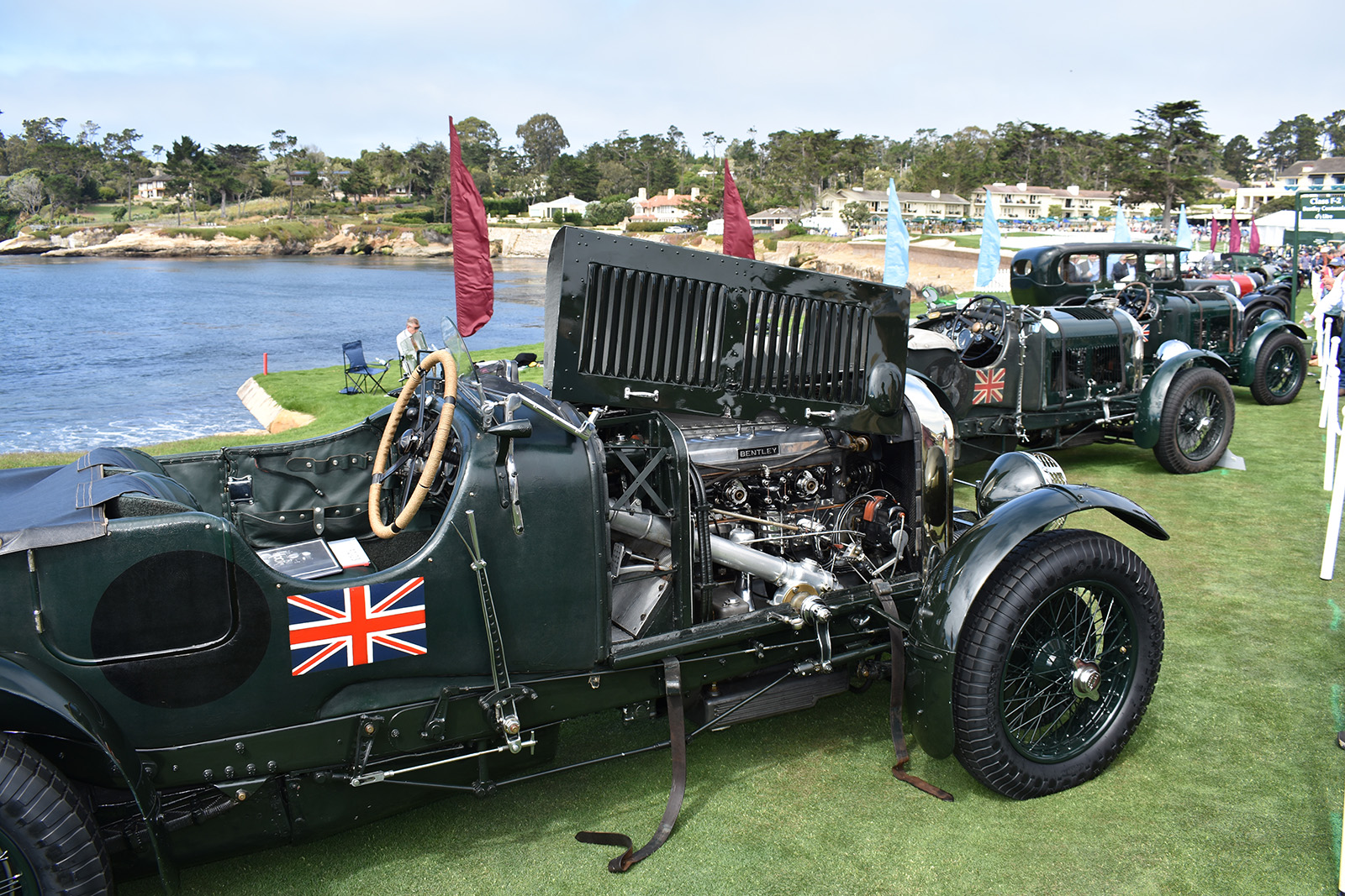 Bentleys line up along the 18th fairway at Pebble Beach