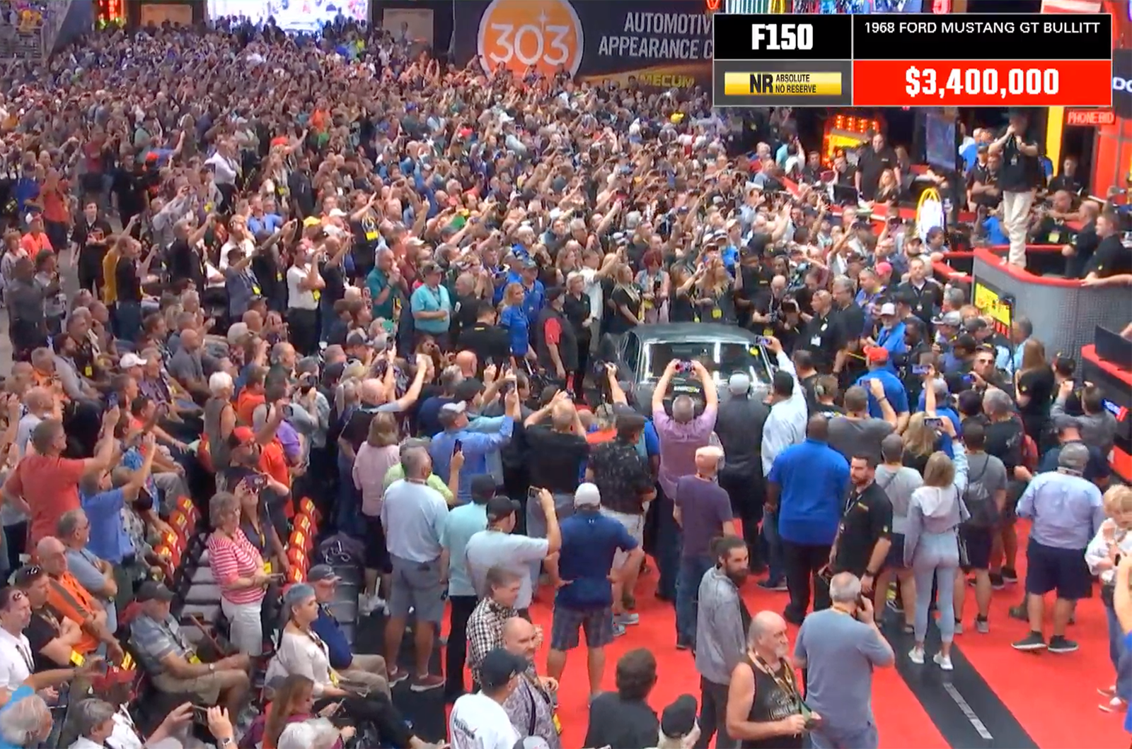 A packed crowd watched the auction