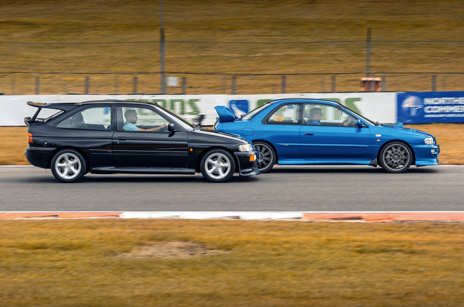 Classic & Sports Car - Black & Blue: Ford Escort RS Cosworth vs Subaru Impreza P1