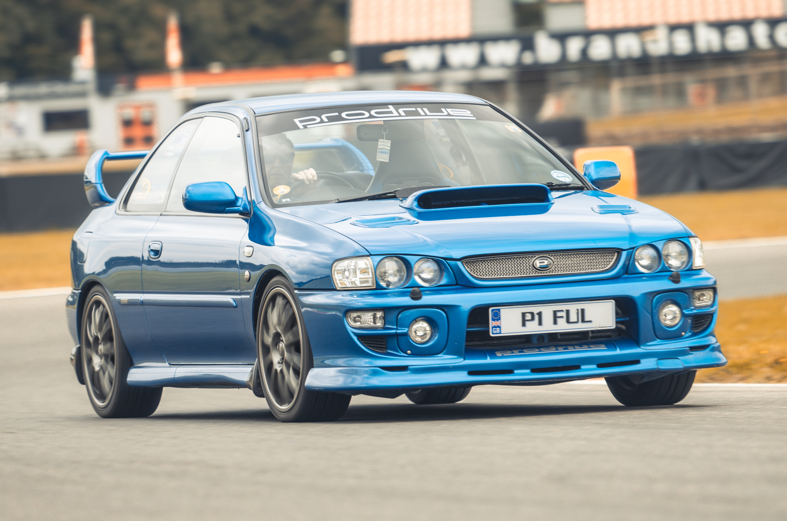 Classic & Sports Car - Black & Blue: Ford Escort RS Cosworth vs Subaru Impreza P1